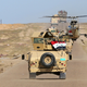 Now that is close air support! Armed Iraqi Jet Rangers provide over-watch for an Iraqi Army convoy. AP Photo
